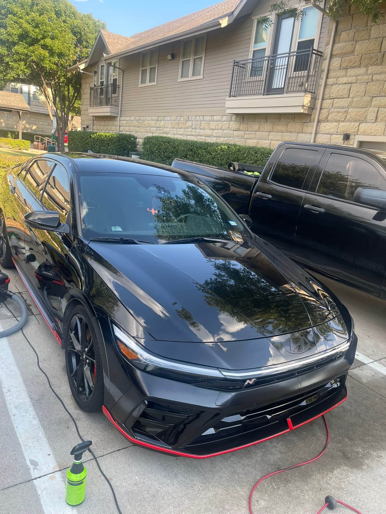 exterior hand wash and ceramic coating a black cadillac